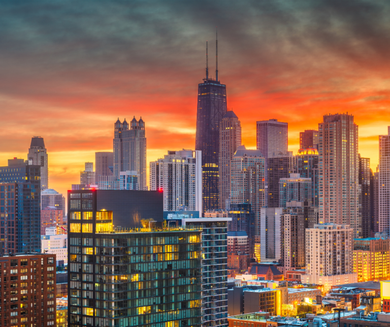 Chicago Illinois downtown city skyline at sunset featuring Willis Tower (Sears Tower) and dramatic orange sky
